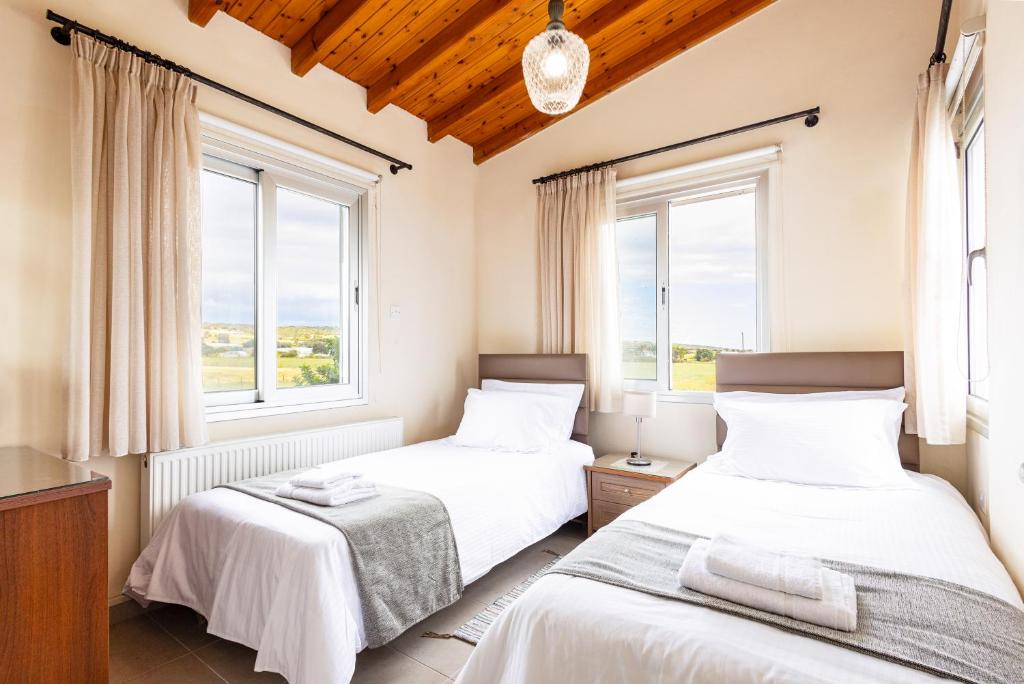 Postel nebo postele na pokoji v ubytování Villa Chrysta