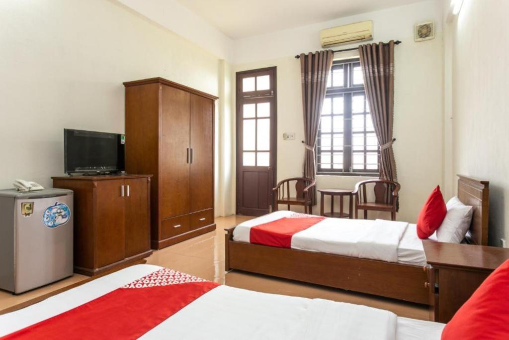 Postel nebo postele na pokoji v ubytování Cửa Đại Beach Hotel