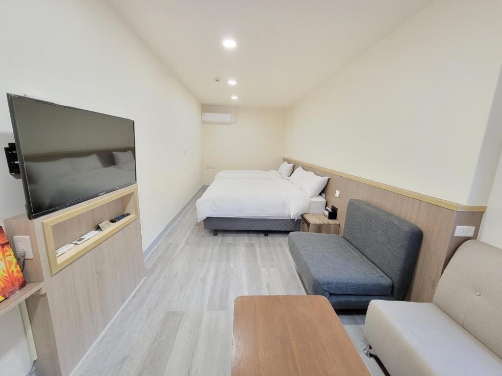 Postel nebo postele na pokoji v ubytování 悠而行旅