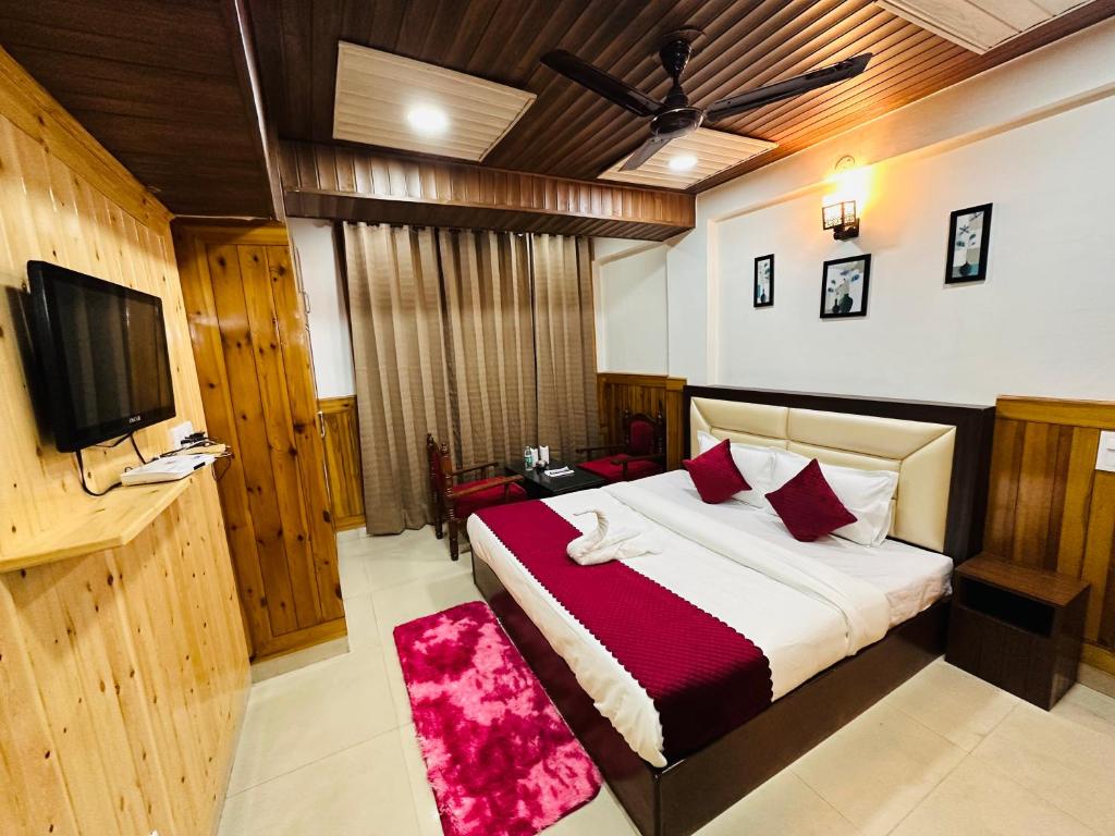 Postel nebo postele na pokoji v ubytování Hotel Avalanche