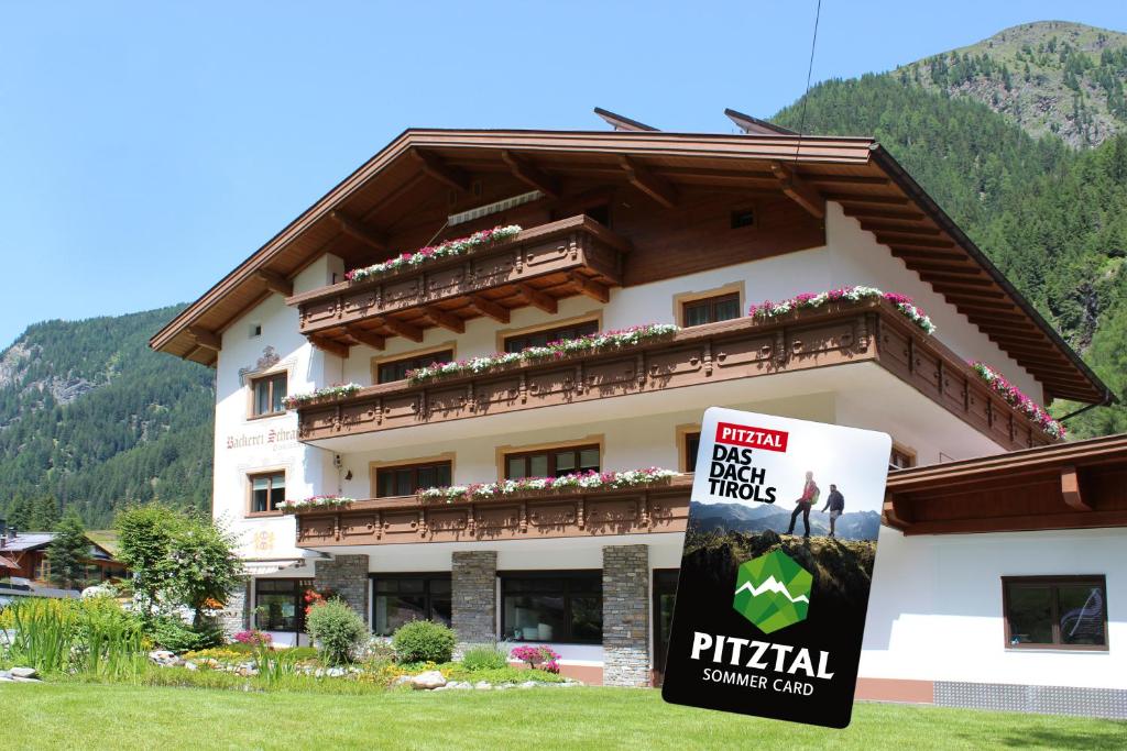 a building with a sign in front of it at Bäckerei Schranz in Sankt Leonhard im Pitztal