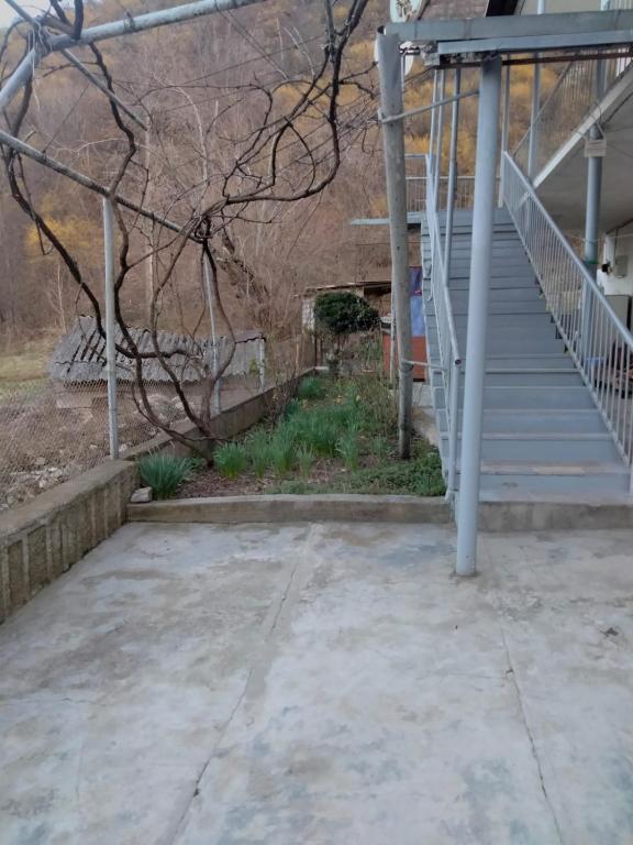 a stairway leading up to a building with stairs at MD Guest House in Getahovit