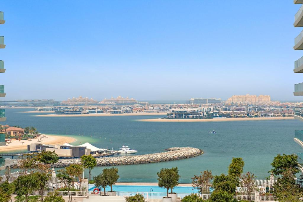 a view of a body of water with a beach at Silkhaus Beach Vibes in Tower with Private Beach in Dubai