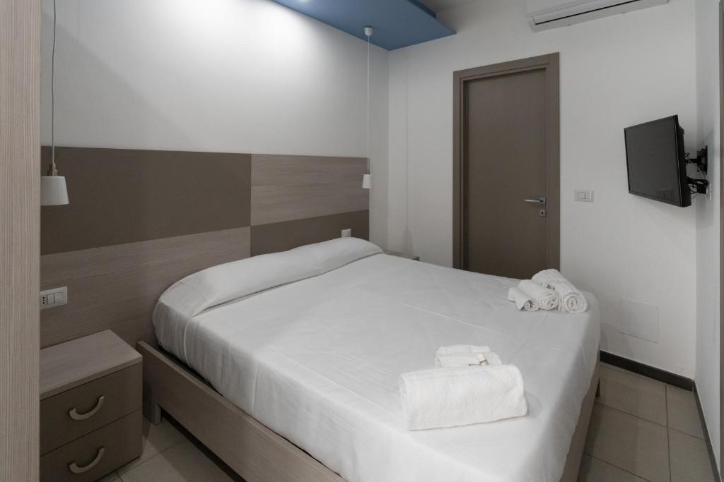 A bed or beds in a room at Notti Magiche