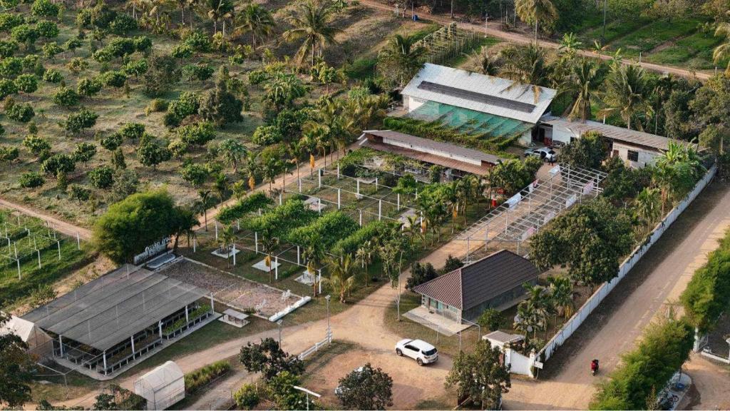 an overhead view of a building with a car parked in front at Quality Time Farmstay: YardHouse#5 in Ban Pa Lau