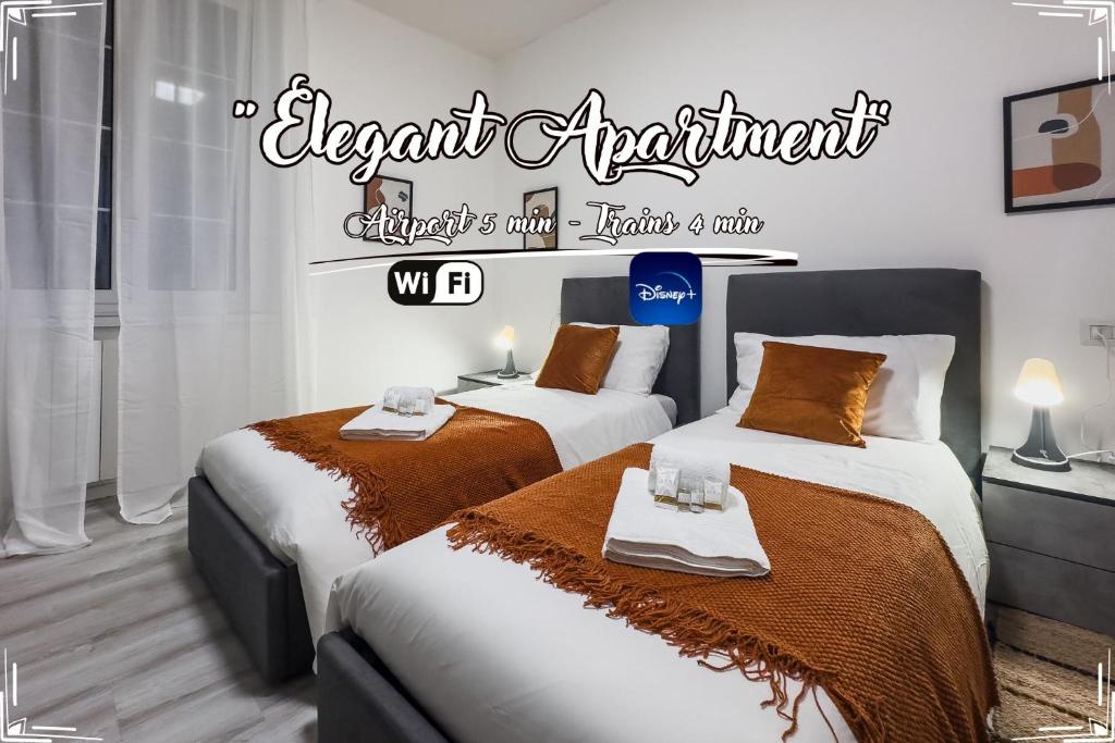 two beds in a room with a sign that reads urgent apartment at [Elegant Apartment] Airport 5min • A/C • Disney+ in Genova