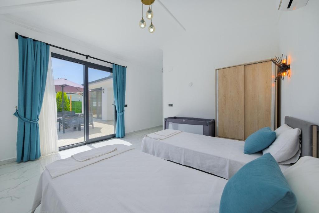 A bed or beds in a room at villa emir 2