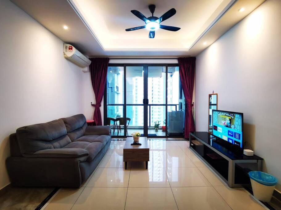 a living room with a couch and a ceiling fan at Sofia Superior Suite 2R2B-51902 at R&F Princess Cove in Johor Bahru