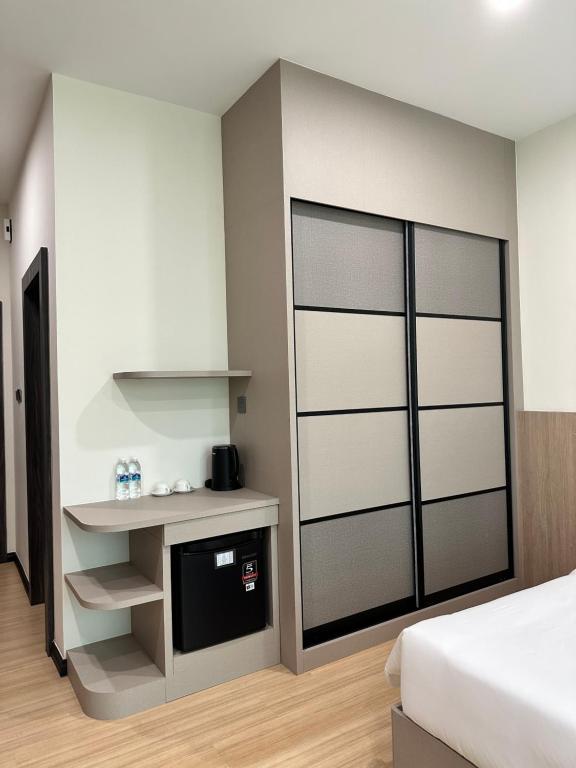 Postel nebo postele na pokoji v ubytování Wendu Inn Hotel