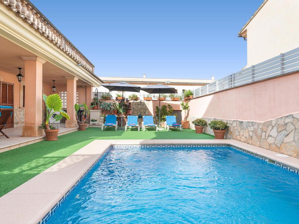 a swimming pool in the backyard of a house at Cas Barber - Villa With Private Pool In Muro Free Wifi in San Lorenzo