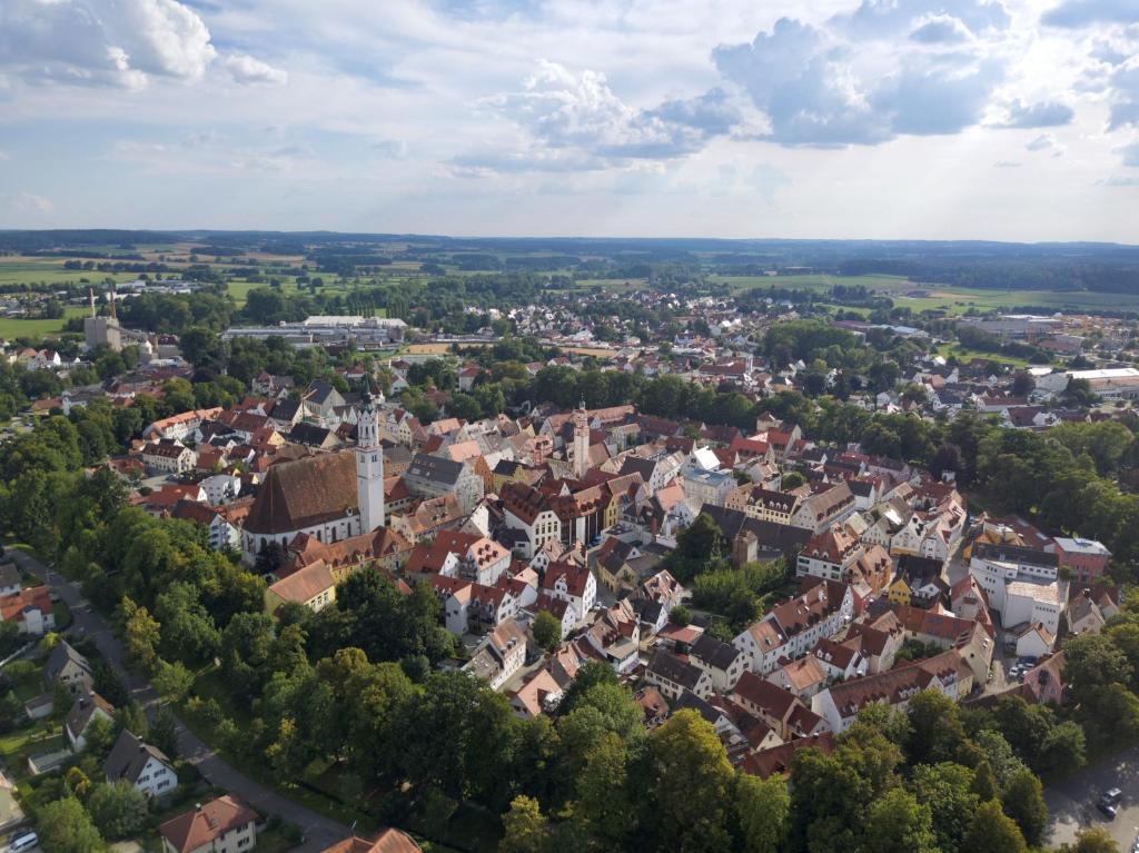 an aerial view of a town with trees and buildings at STORK'S NEST in Schrobenhausen