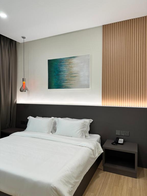Postel nebo postele na pokoji v ubytování Wendu Inn Hotel
