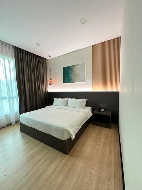 Postel nebo postele na pokoji v ubytování Wendu Inn Hotel