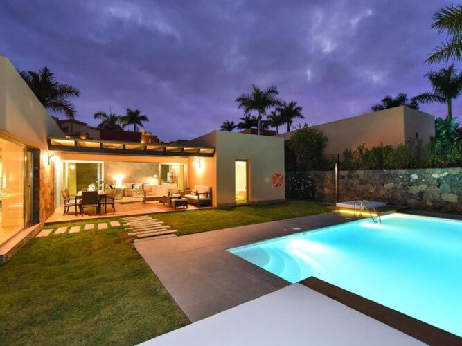 a house with a swimming pool in the yard at Holiday Home Maspalomas - LPA03100b-F in Maspalomas