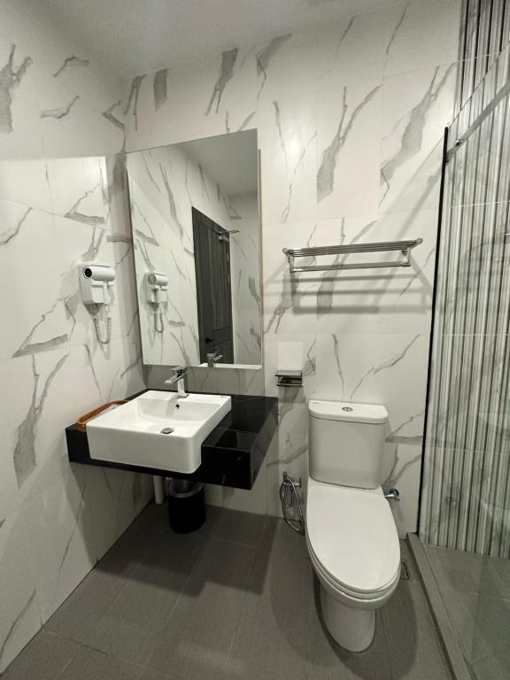 Koupelna v ubytování Wendu Inn Hotel
