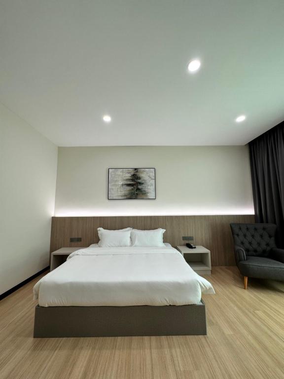 Postel nebo postele na pokoji v ubytování Wendu Inn Hotel