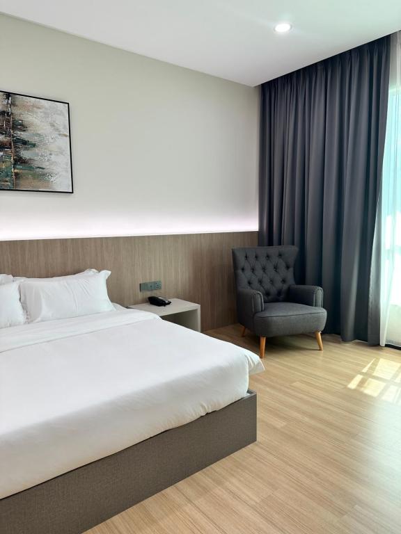 Postel nebo postele na pokoji v ubytování Wendu Inn Hotel