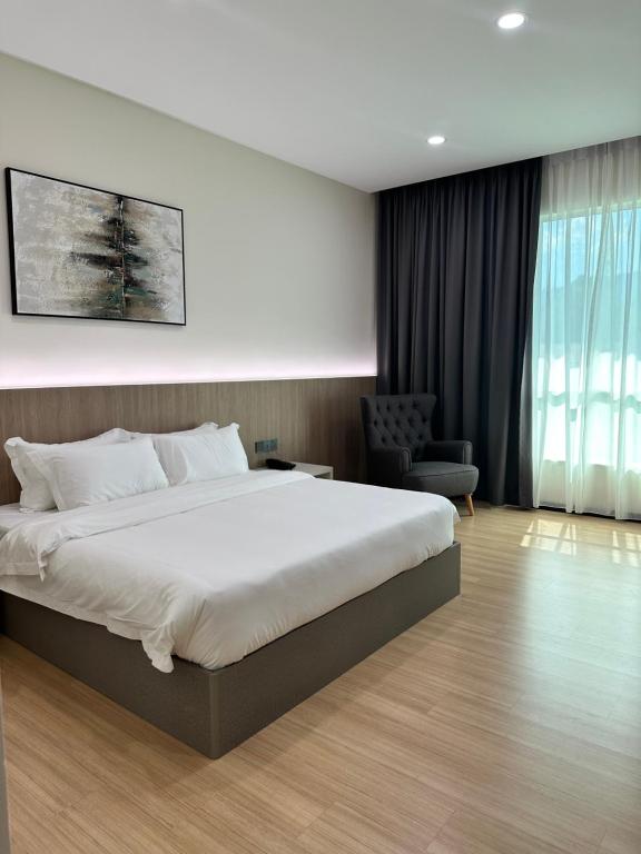 Postel nebo postele na pokoji v ubytování Wendu Inn Hotel