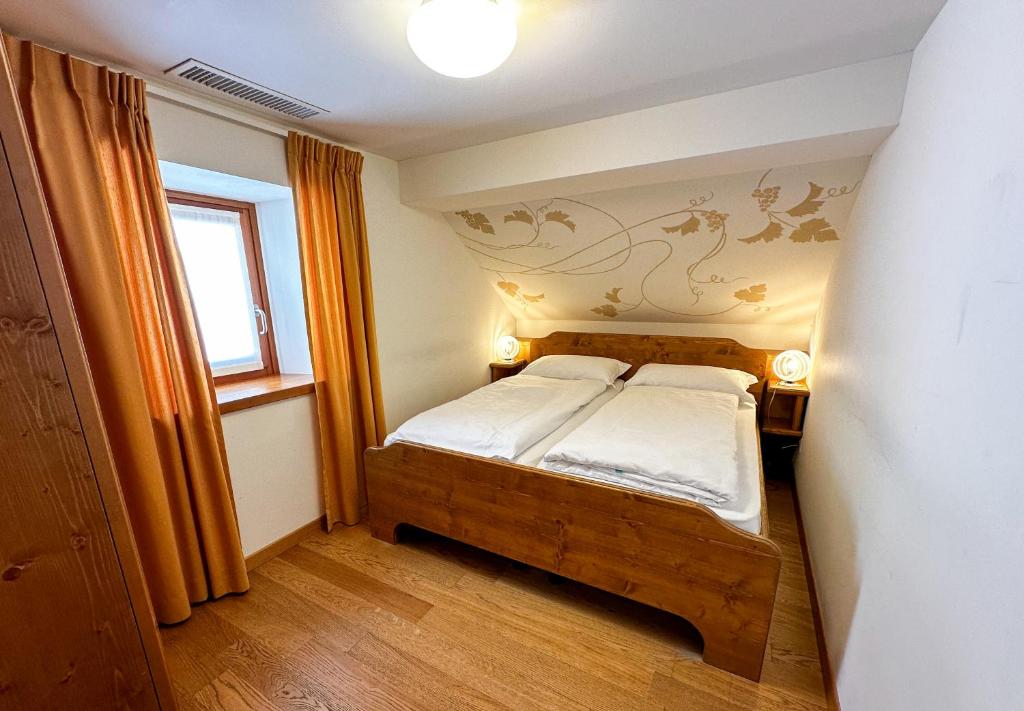 Postel nebo postele na pokoji v ubytování Locanda Orelli