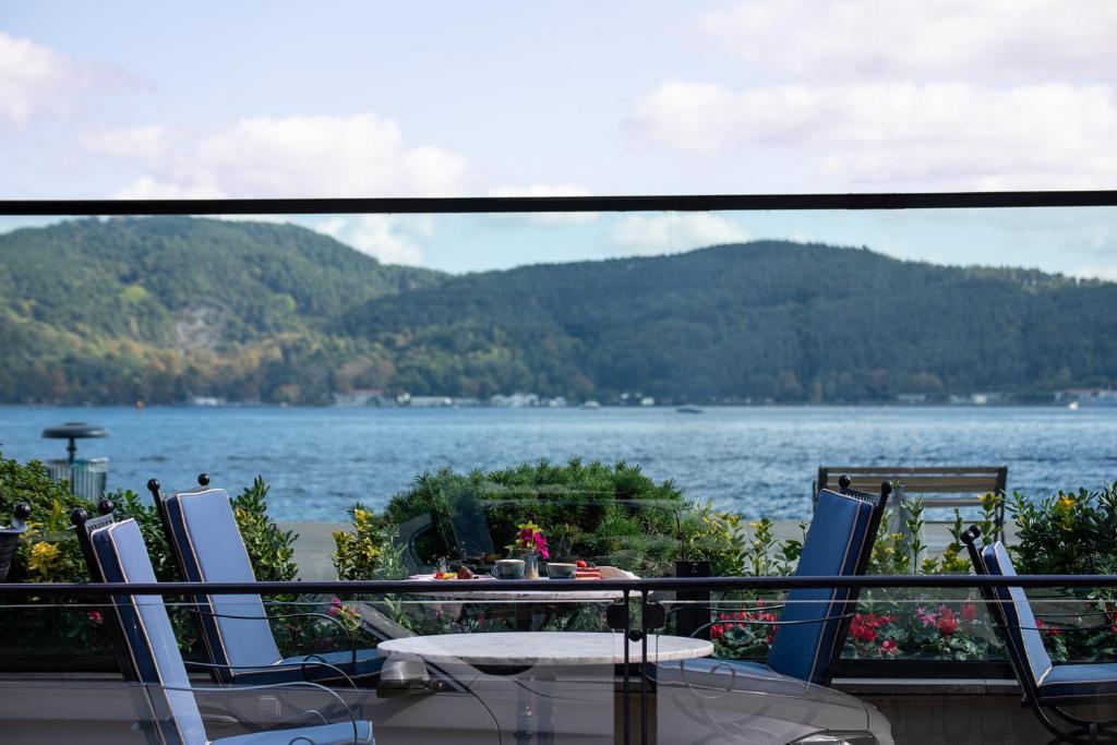 a balcony with a view of a lake at MFB Tarabya Hotel in Istanbul