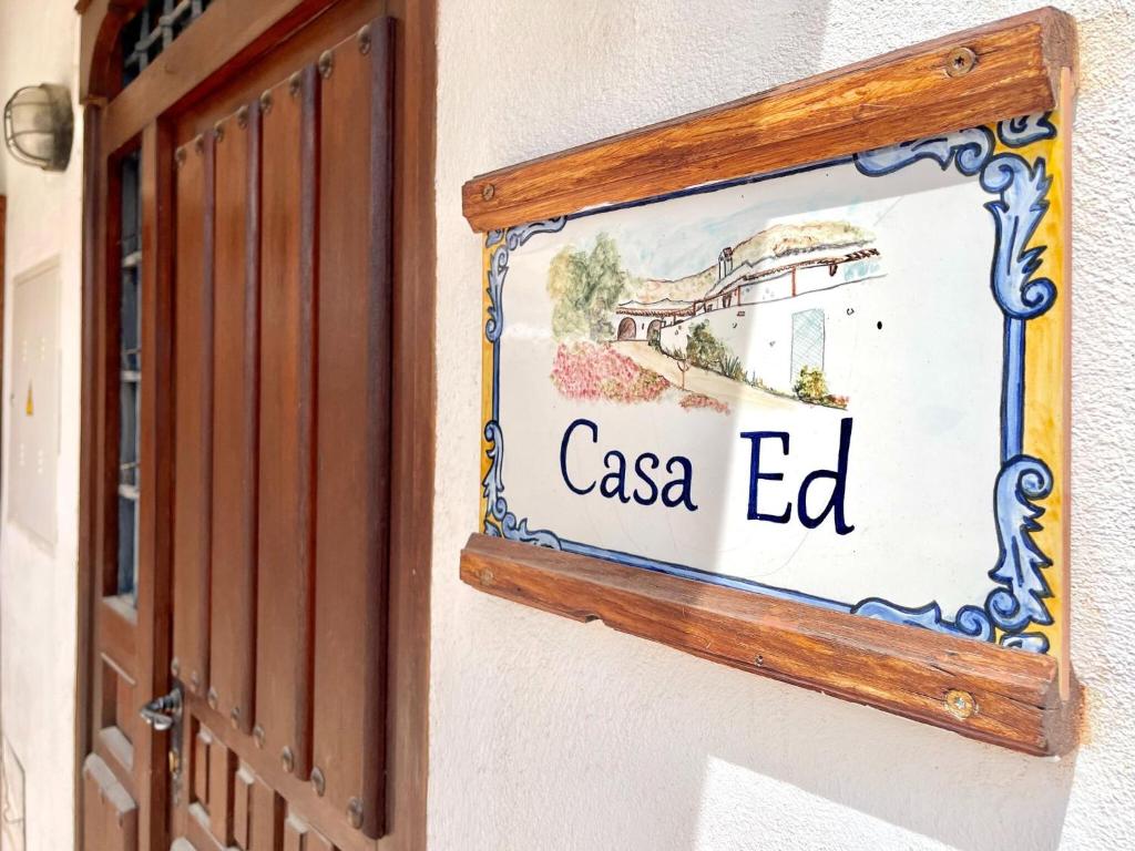 a sign for a casa ed hanging on a wall at Cave Houses Ed Yara and Nadieh with PRM facilities in Margen de Abajo