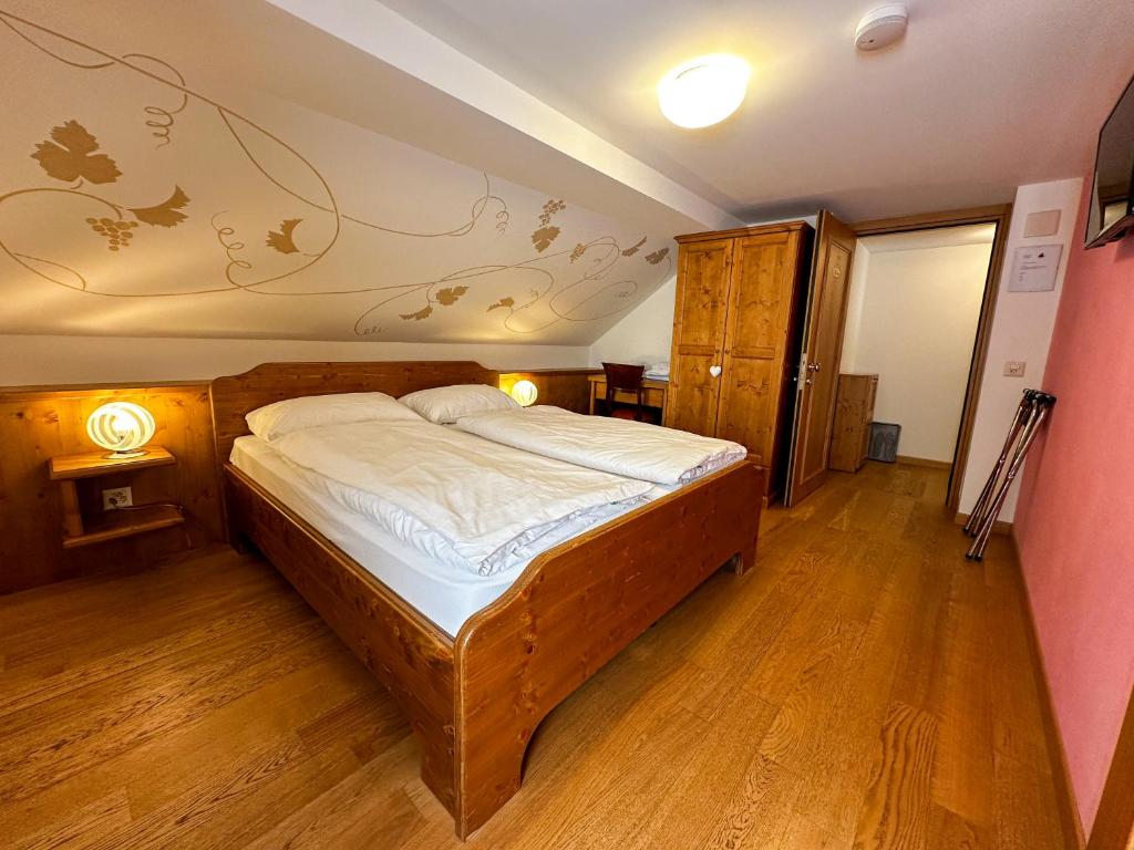 Postel nebo postele na pokoji v ubytování Locanda Orelli