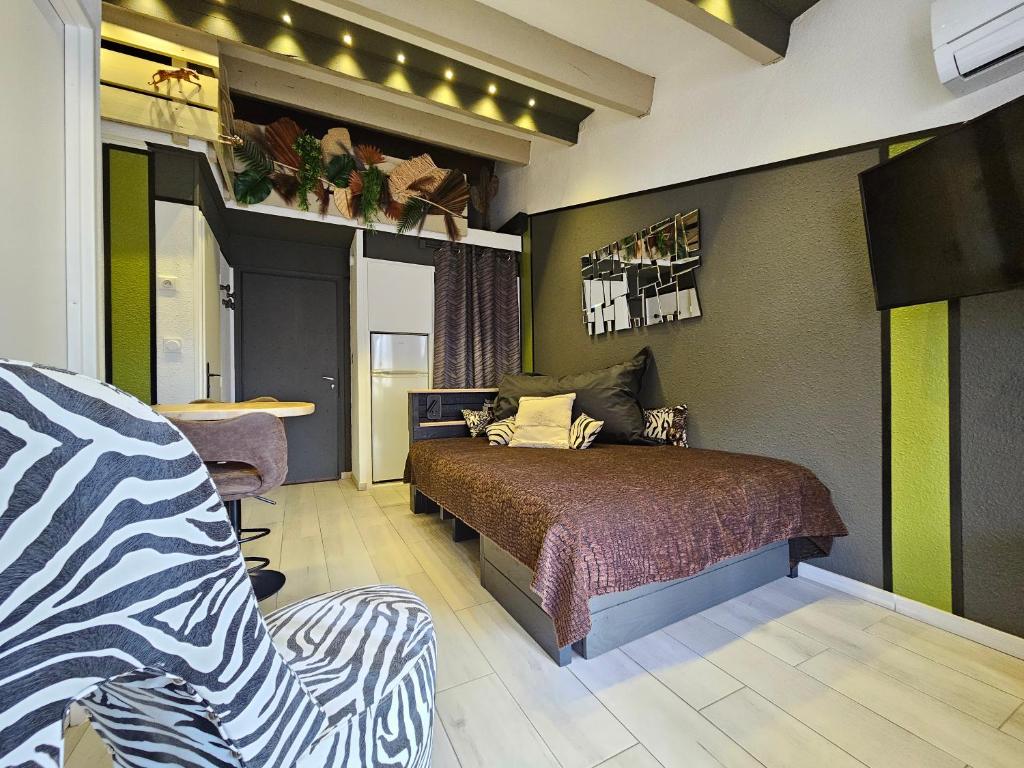 Posteľ alebo postele v izbe v ubytovaní Appartement Style Loft - proche Village Naturiste