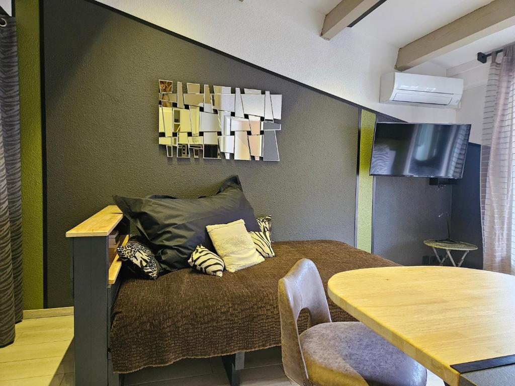 Posedenie v ubytovaní Appartement Style Loft - proche Village Naturiste