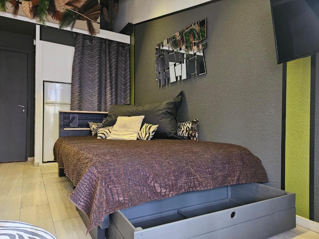 Posteľ alebo postele v izbe v ubytovaní Appartement Style Loft - proche Village Naturiste