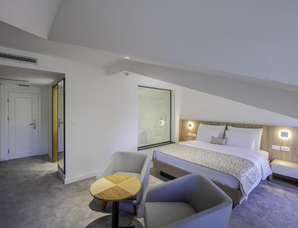Postel nebo postele na pokoji v ubytování Hotel Podrinje