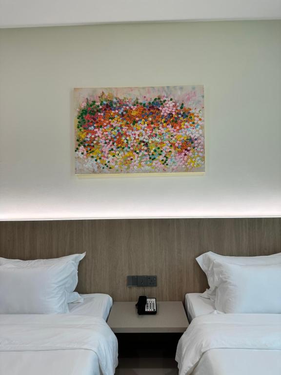 Postel nebo postele na pokoji v ubytování Wendu Inn Hotel
