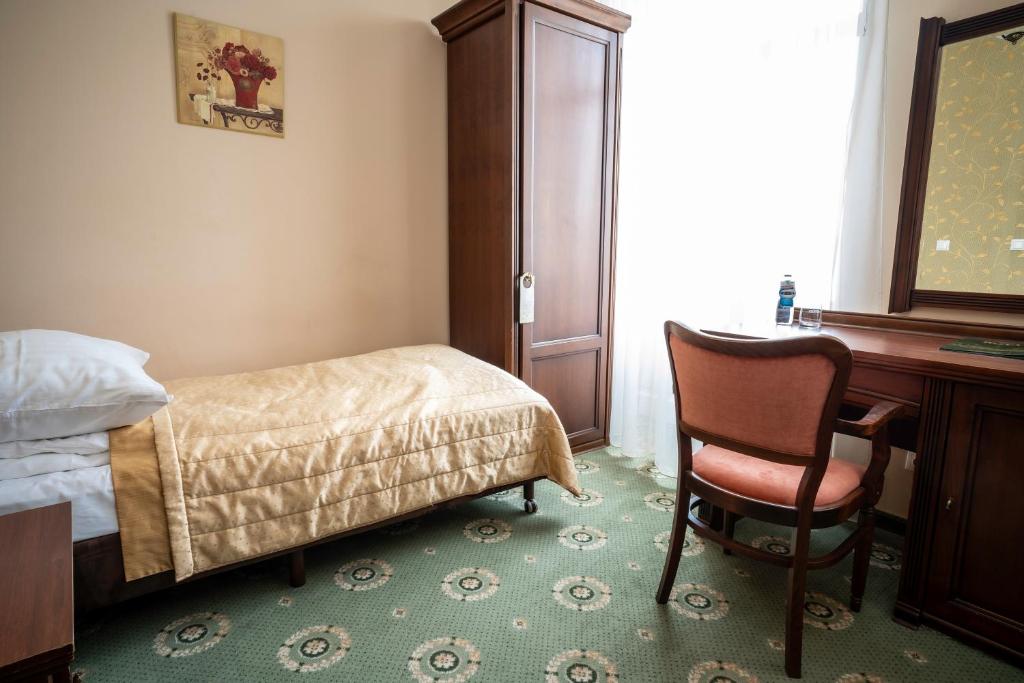 Posteľ alebo postele v izbe v ubytovaní Hotel Arkadia Royal