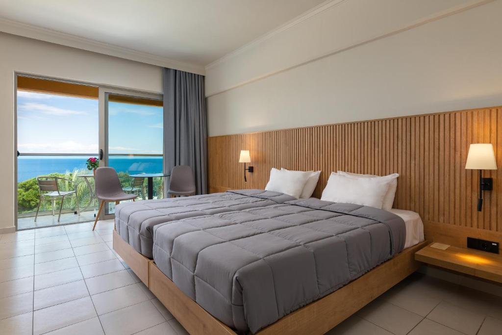 Postel nebo postele na pokoji v ubytování Kresten Palace Hotel