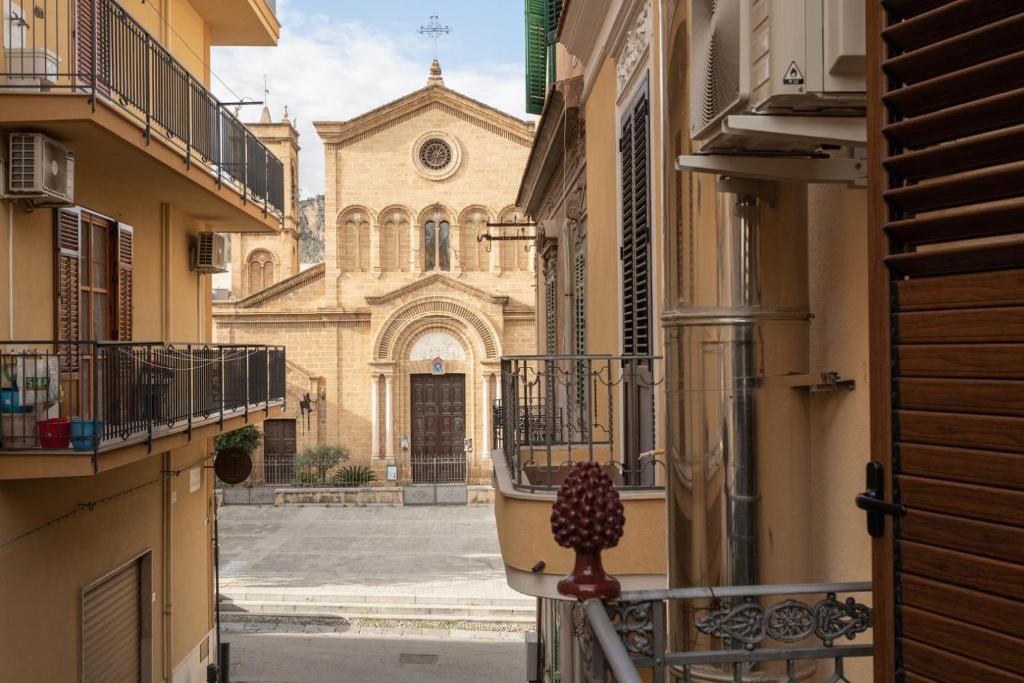 a view of a church from a balcony of a building at Casa Butera in Bagheria