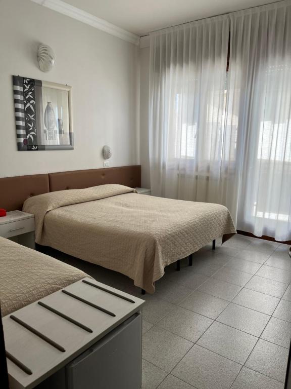 Postel nebo postele na pokoji v ubytování Hotel Touring