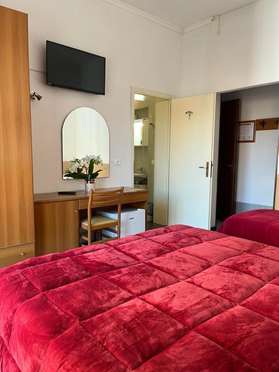 Postel nebo postele na pokoji v ubytování Hotel Touring