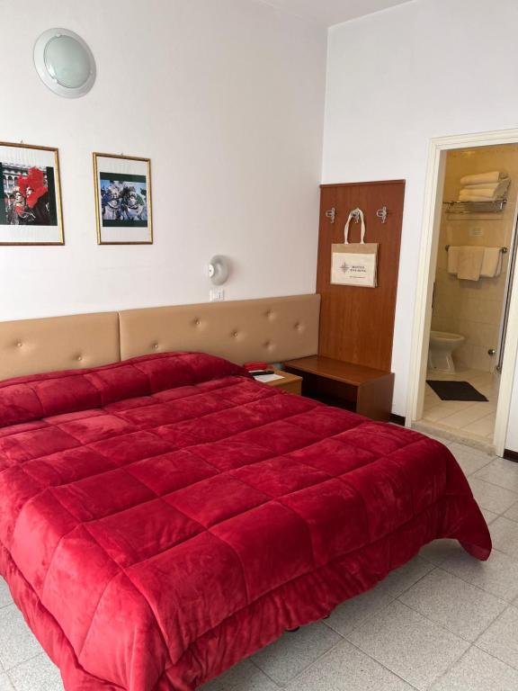 Postel nebo postele na pokoji v ubytování Hotel Touring