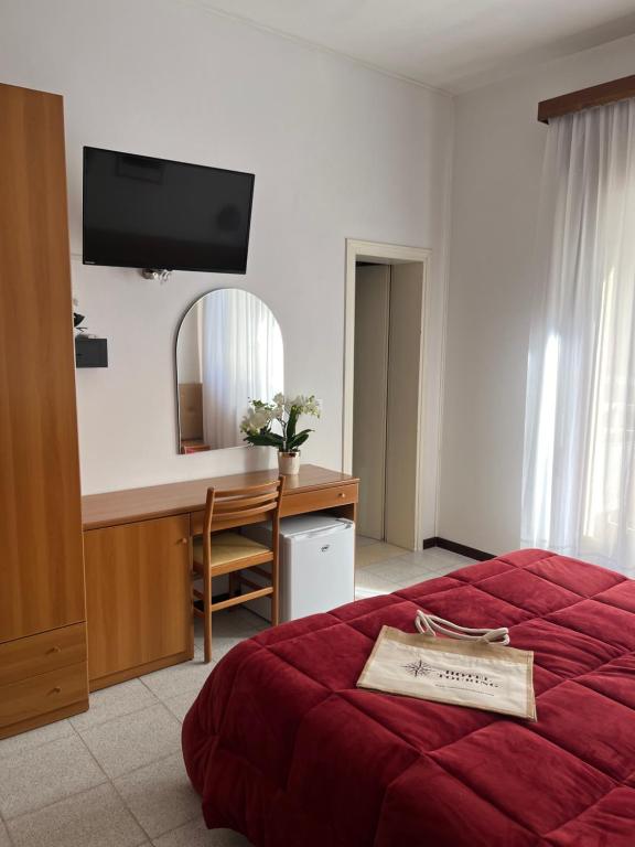 Postel nebo postele na pokoji v ubytování Hotel Touring