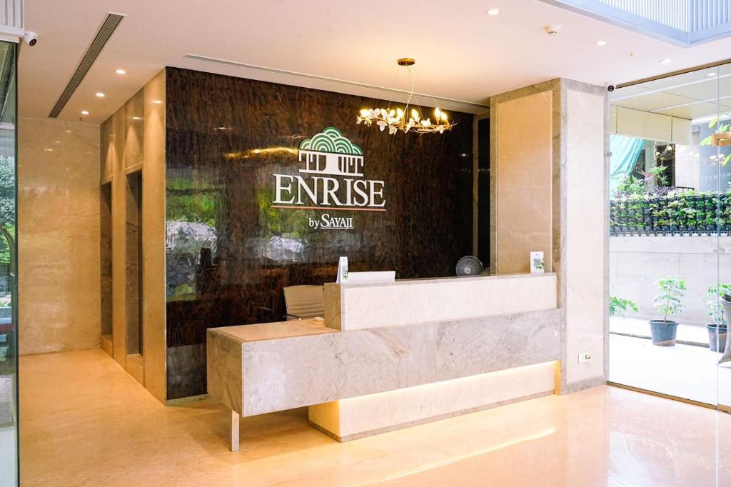 an entrance to a restaurant with a sign on a wall at Enrise by Sayaji Nagpur in Nagpur