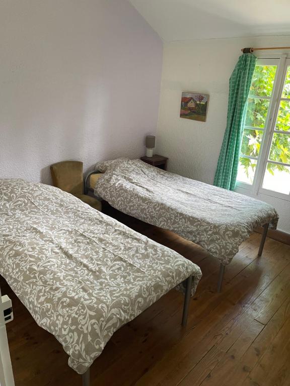 Postel nebo postele na pokoji v ubytování Saint Sever des Pyrenees
