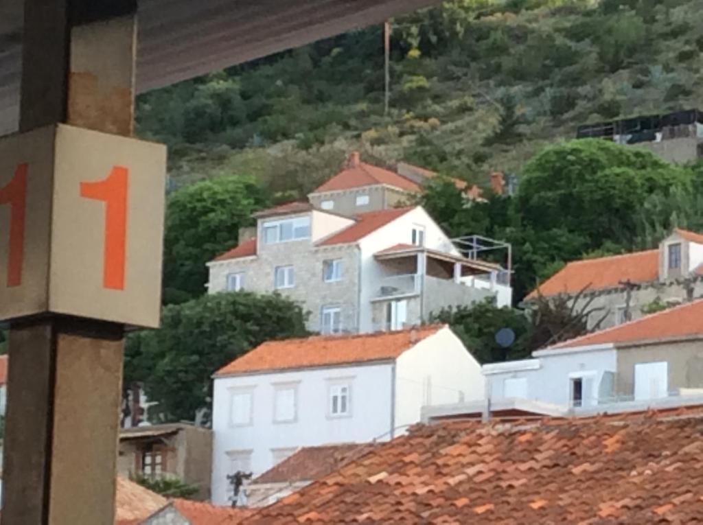 a view of a city with houses on a hill at Pupo Rooms in Dubrovnik