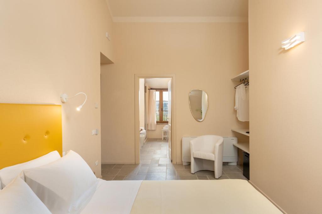 Postel nebo postele na pokoji v ubytování Agriturismo Tenuta i 4 venti