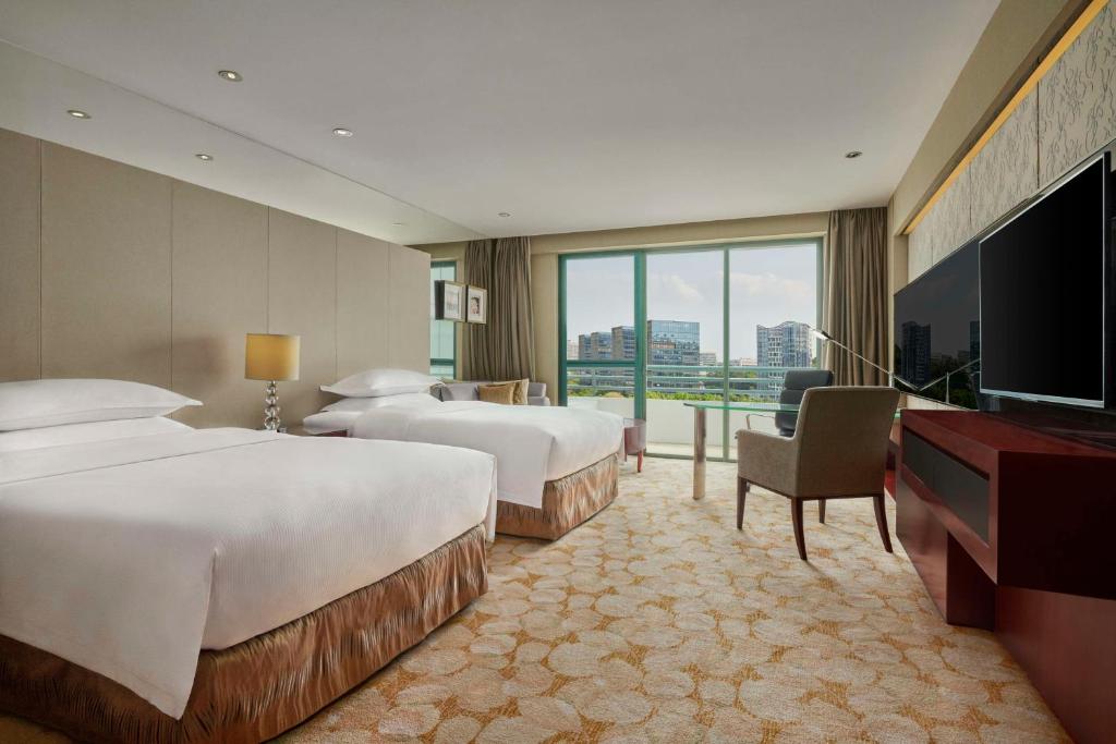Postel nebo postele na pokoji v ubytování Hilton Guangzhou Science City, Free Shuttle Bus during Canton Fair