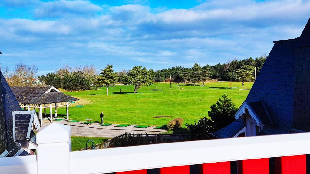 a view of a park with a field of grass at Argousiers 123 in Fort-Mahon-Plage