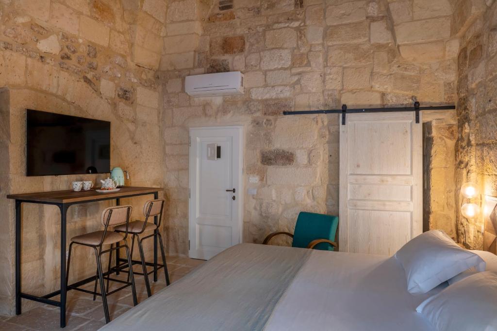 Postel nebo postele na pokoji v ubytování Palazzo Sant'Anna Lecce