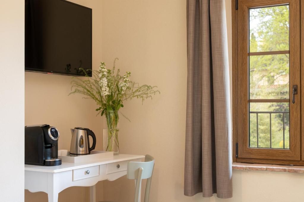 TV a/nebo společenská místnost v ubytování Agriturismo Tenuta i 4 venti