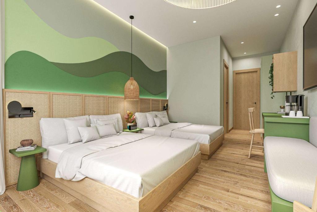 1 dormitorio con 2 camas y cocina en Viva Miches by Wyndham, a Trademark All Inclusive Resort, en Miches