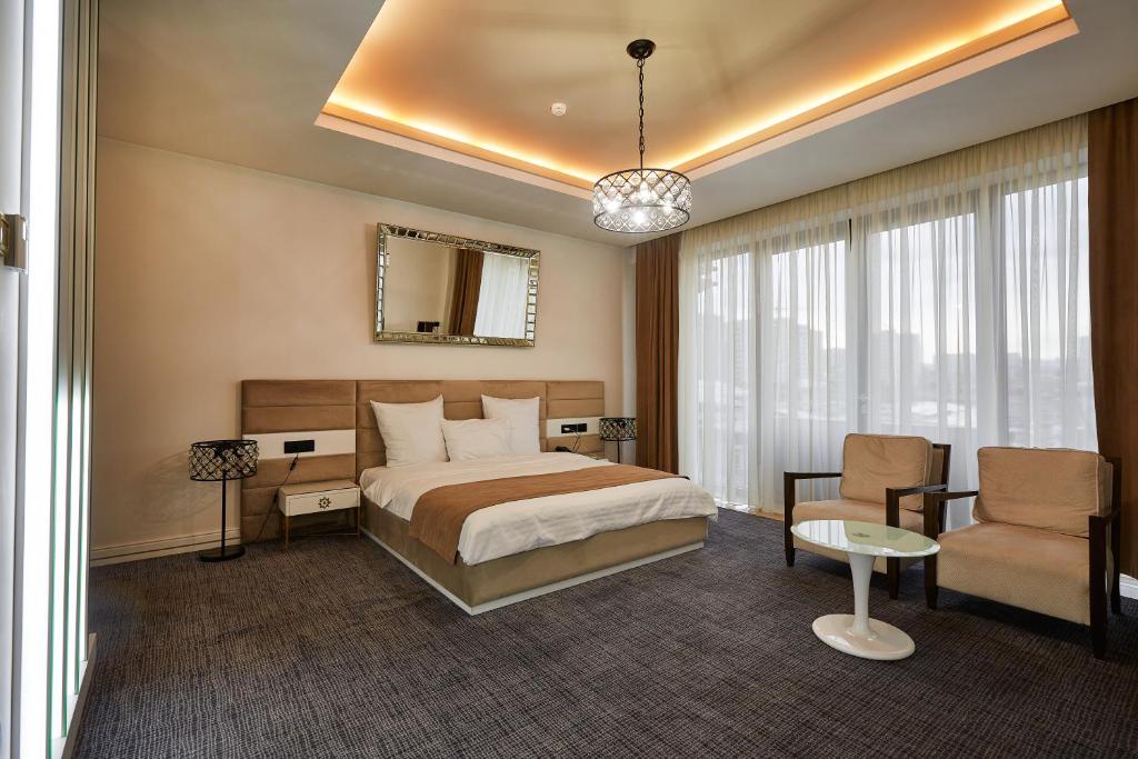 Postel nebo postele na pokoji v ubytování Aghababyan's Hotel