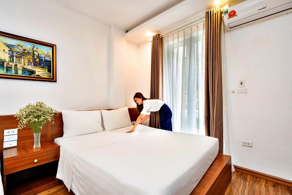 Postel nebo postele na pokoji v ubytování S79 Ami Hotel