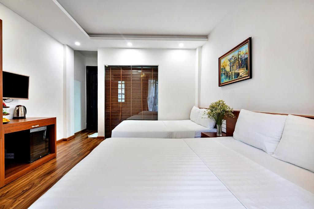Postel nebo postele na pokoji v ubytování S79 Ami Hotel